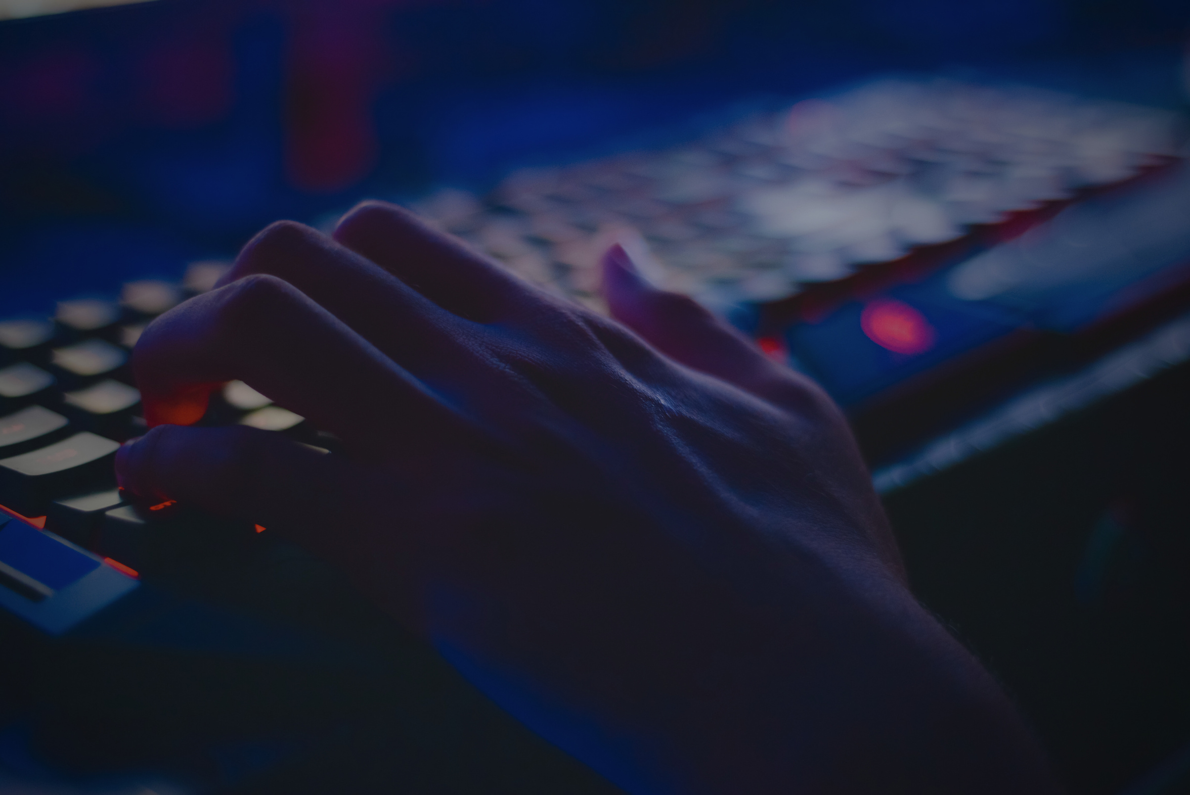 Photo of Person Typing on Computer Keyboard